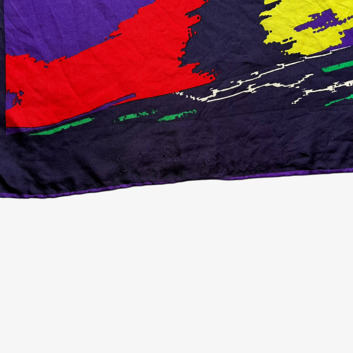 Hand rolled edges on women's vintage 90s Pierre Cardin colourful abstract print purple silk scarf.