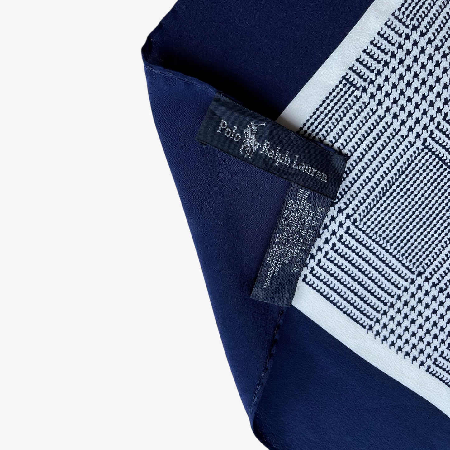 Label of vintage 90s women's Ralph Lauren golf player and houndstooth print navy silk scarf.