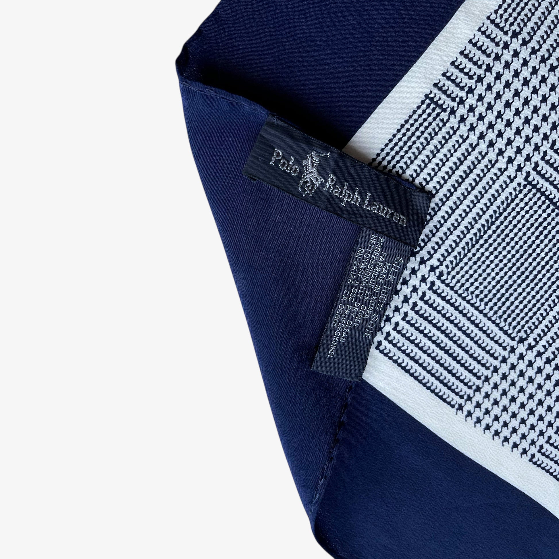 Label of vintage 90s women's Ralph Lauren golf player and houndstooth print navy silk scarf.