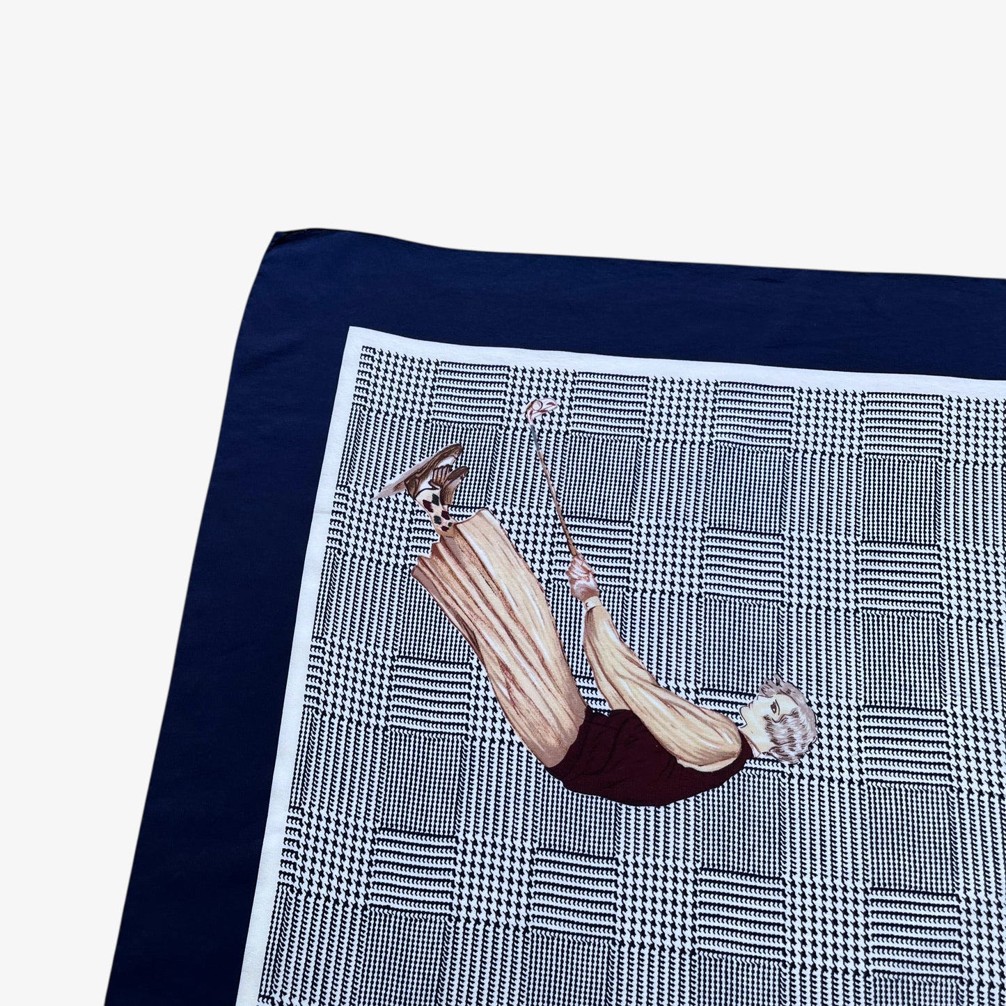 Checkered dogtooth pattern on vintage 90s women's Ralph Lauren golf player and houndstooth print navy silk scarf.