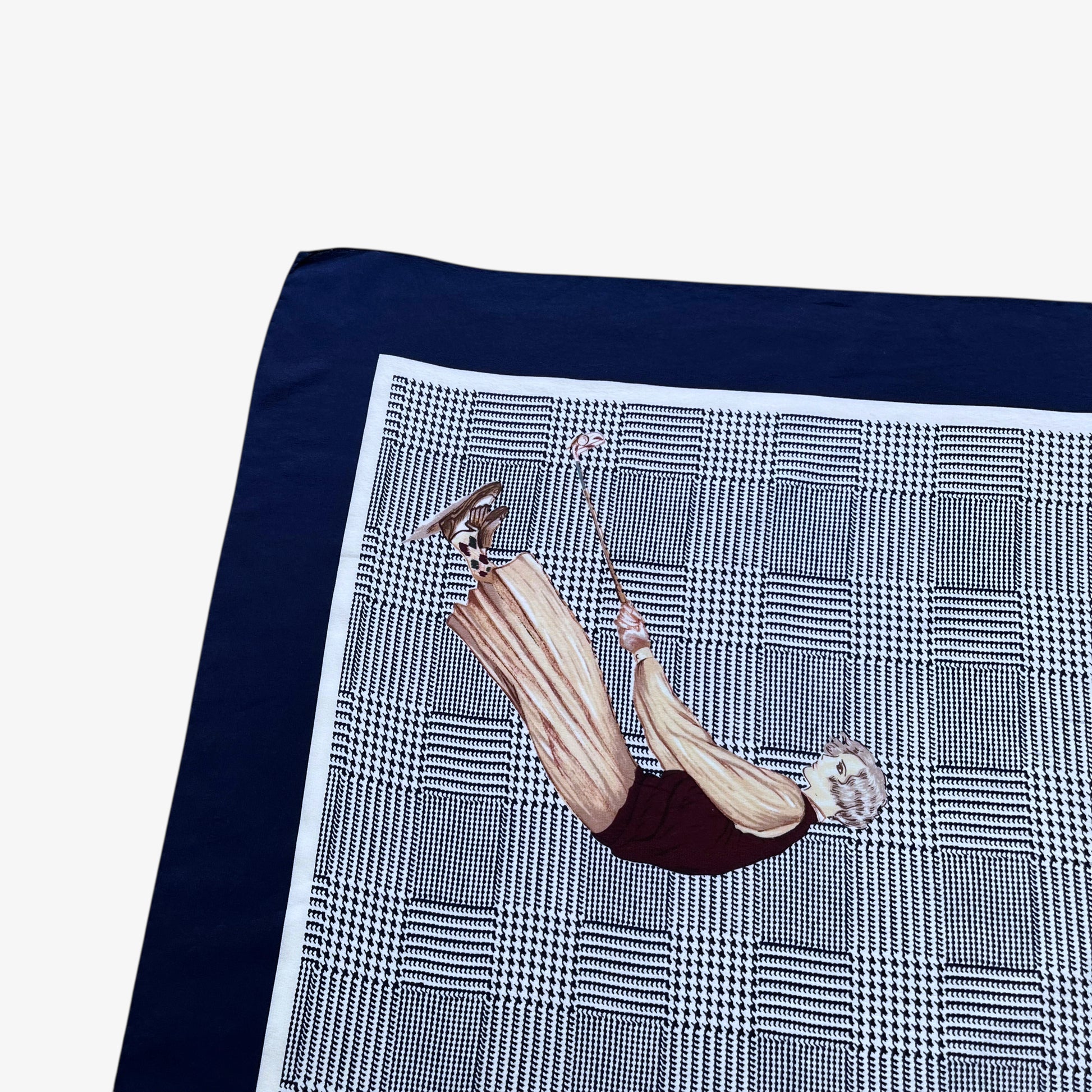 Checkered dogtooth pattern on vintage 90s women's Ralph Lauren golf player and houndstooth print navy silk scarf.