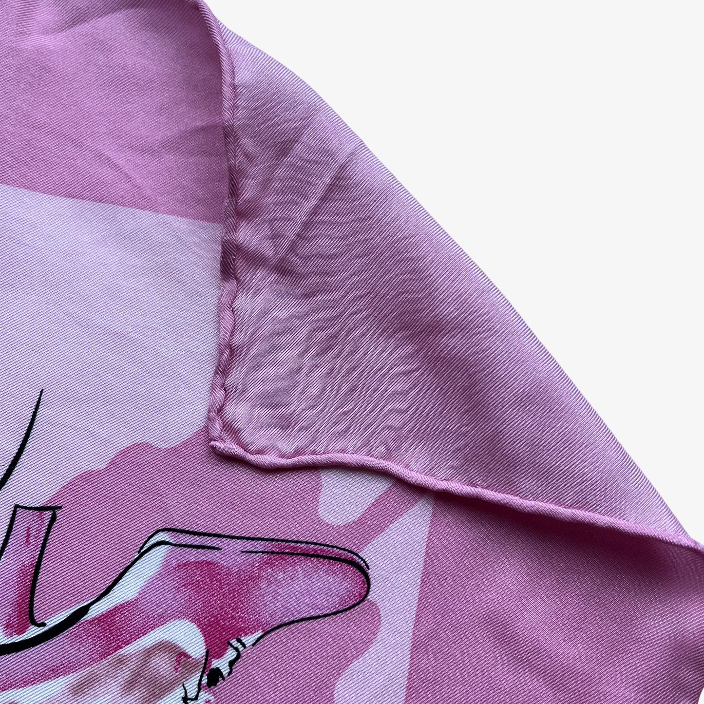 Hand rolled edges on women's vintage 90s Salvatore Ferragamo high heel shoe butterfly print pink silk scarf.