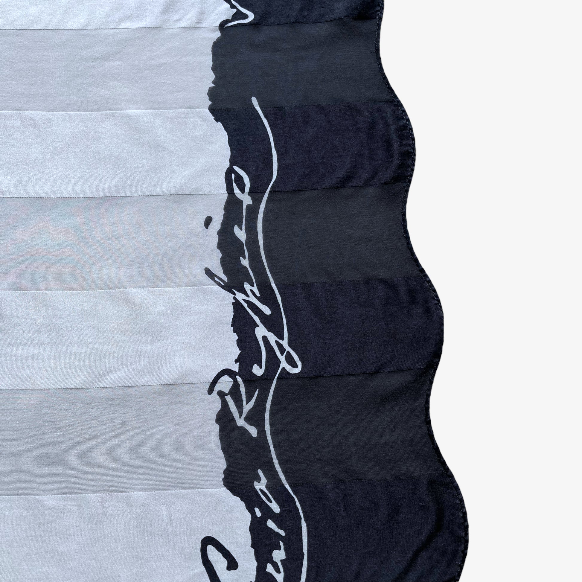 General wear on vintage 90s women's Sonia Rykiel foulards black and white spell out print striped silk scarf.