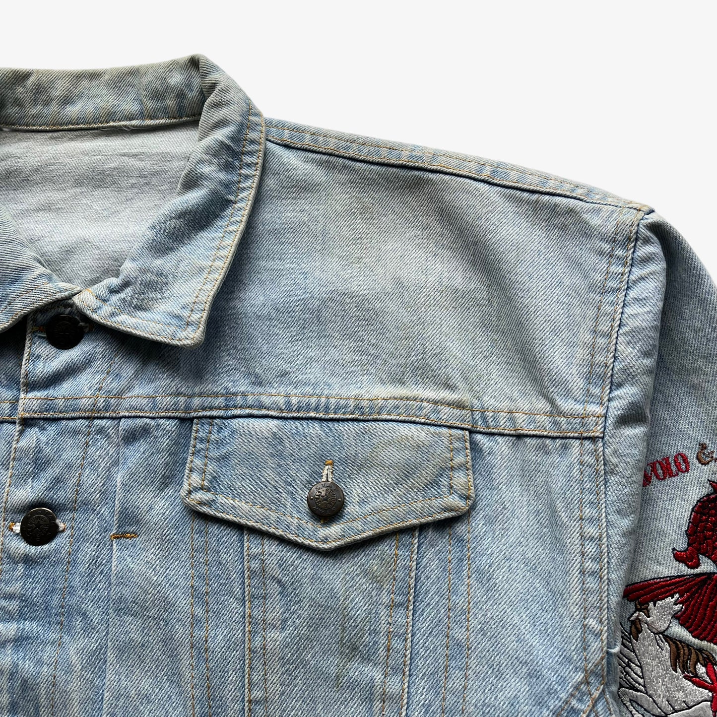 Patina of vintage 90s women's Diavolo and Angeli star club blue denim jacket with back embroidered dragon.