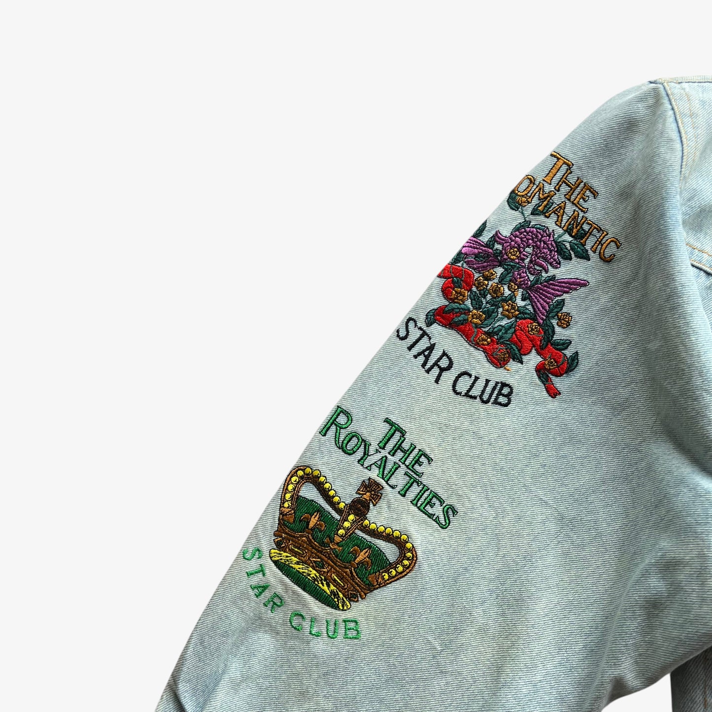 Embroidered star club spell out of vintage 90s women's Diavolo and Angeli blue denim jacket with back dragon.