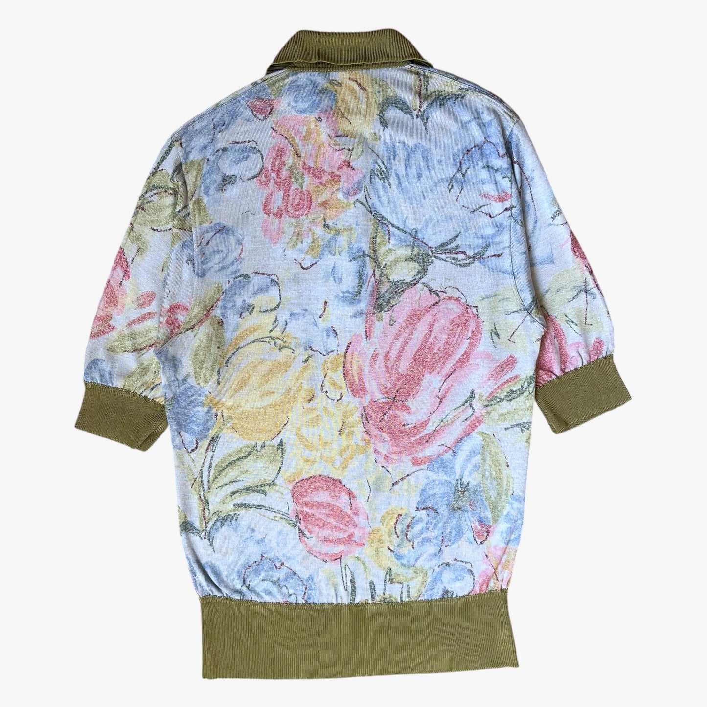 Back of a vintage 90s women's Max Mara floral print knitted shirt with green contrasting collar.