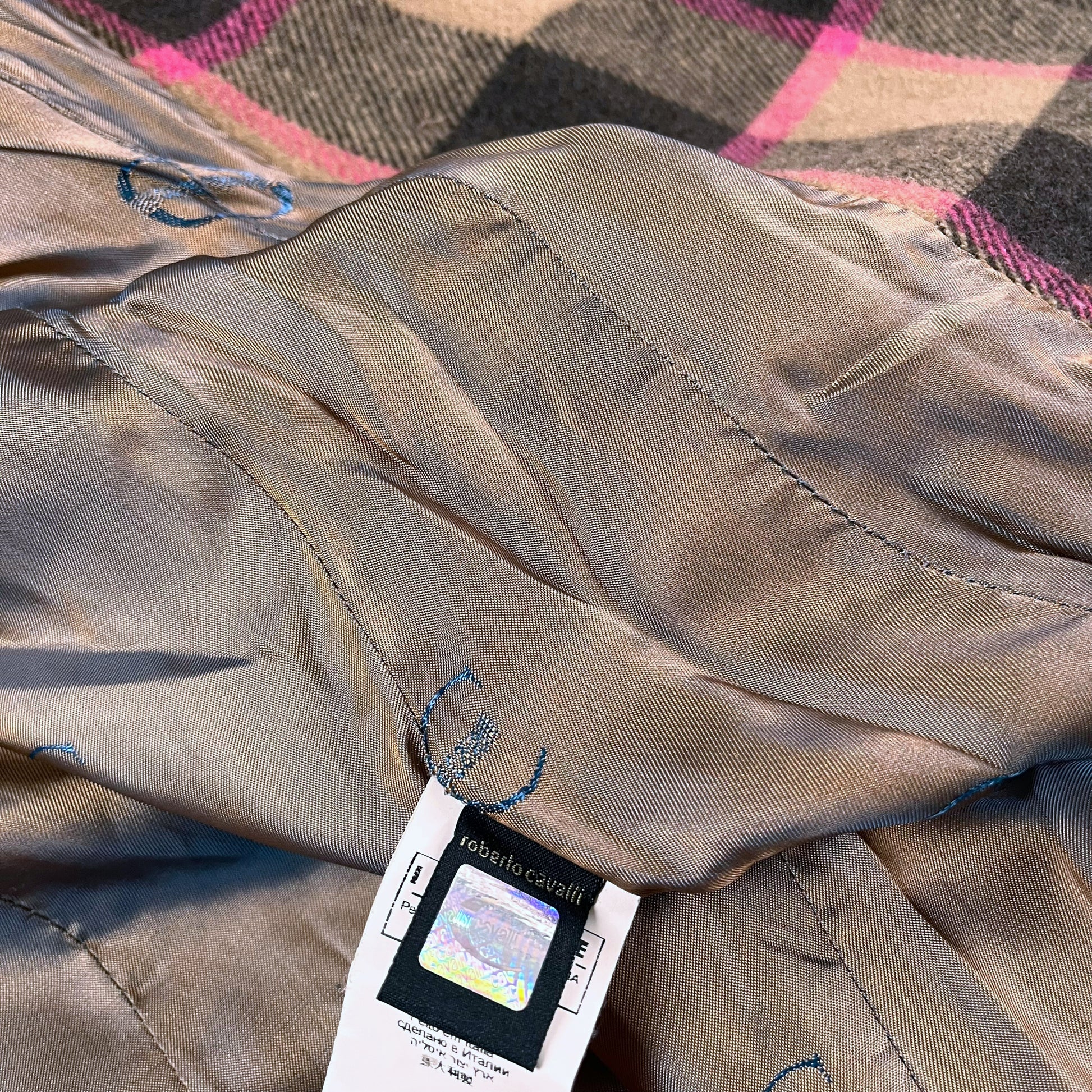 Authentic hologram label inside of vintage 90s Roberto Cavalli women’s brown and pink tartan and plaid double breasted wool blend coat.