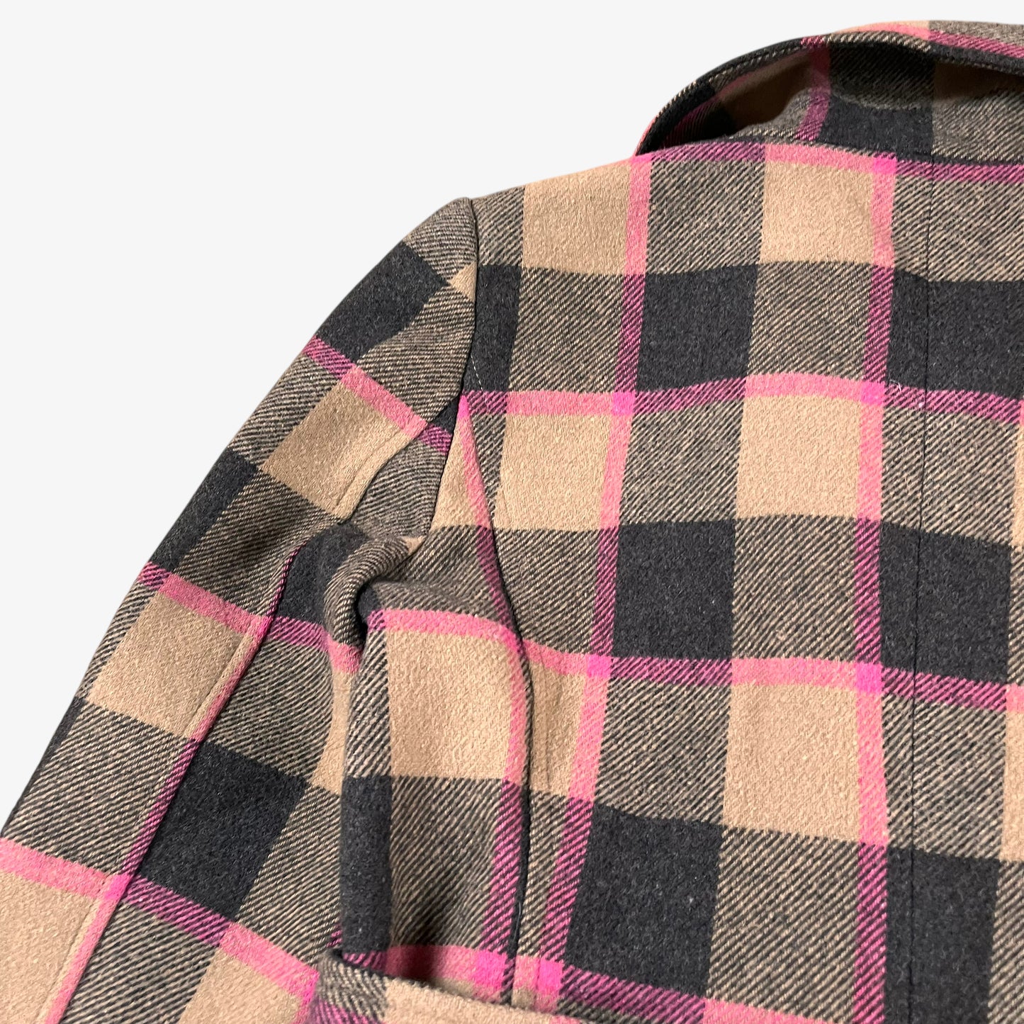 Wear on shoulder of vintage 90s Roberto Cavalli women’s brown and pink tartan and plaid double breasted wool blend coat.