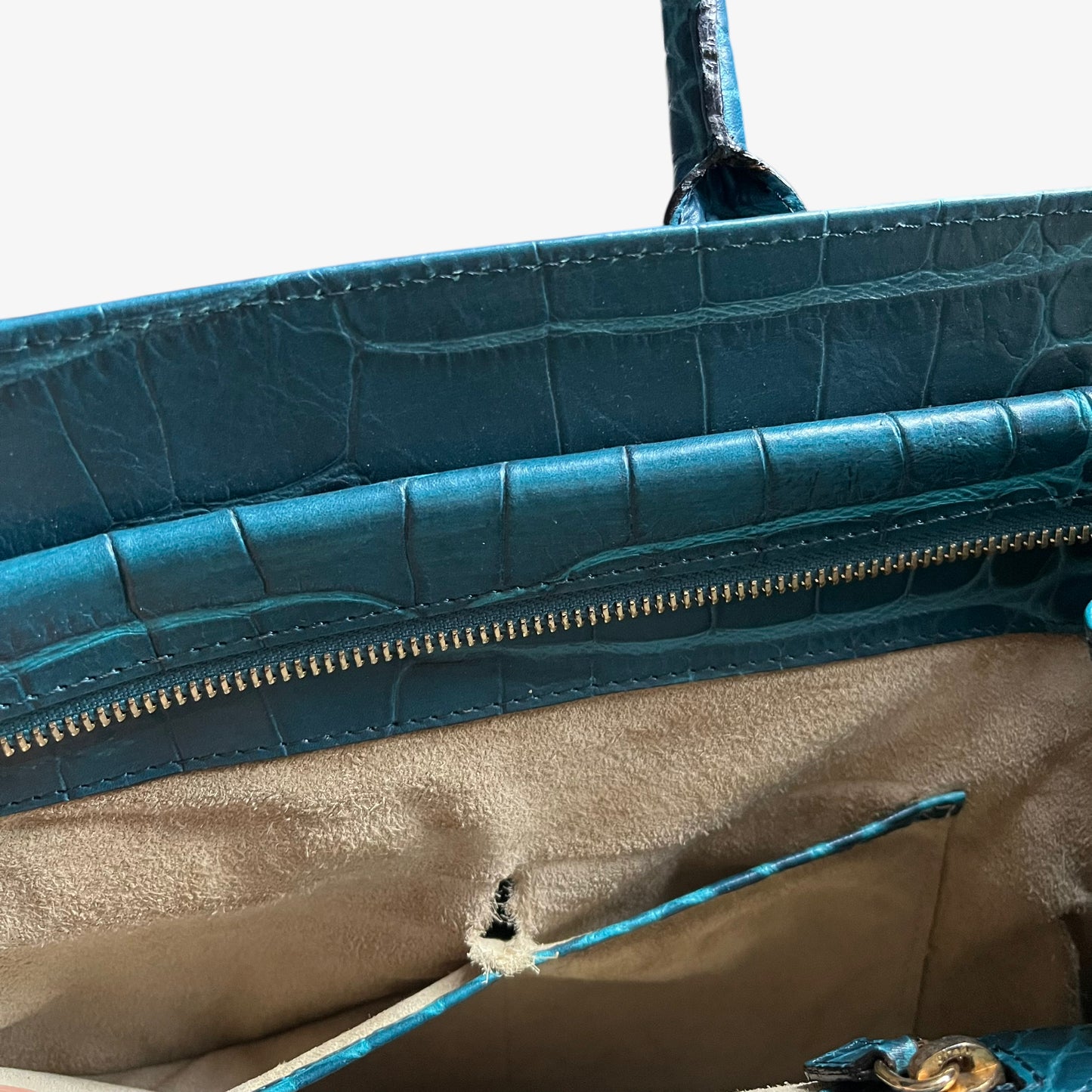 Wear on the inside pocket of vintage Y2K women's Anya Hindmarch blue croc embossed leather shoulder bag.