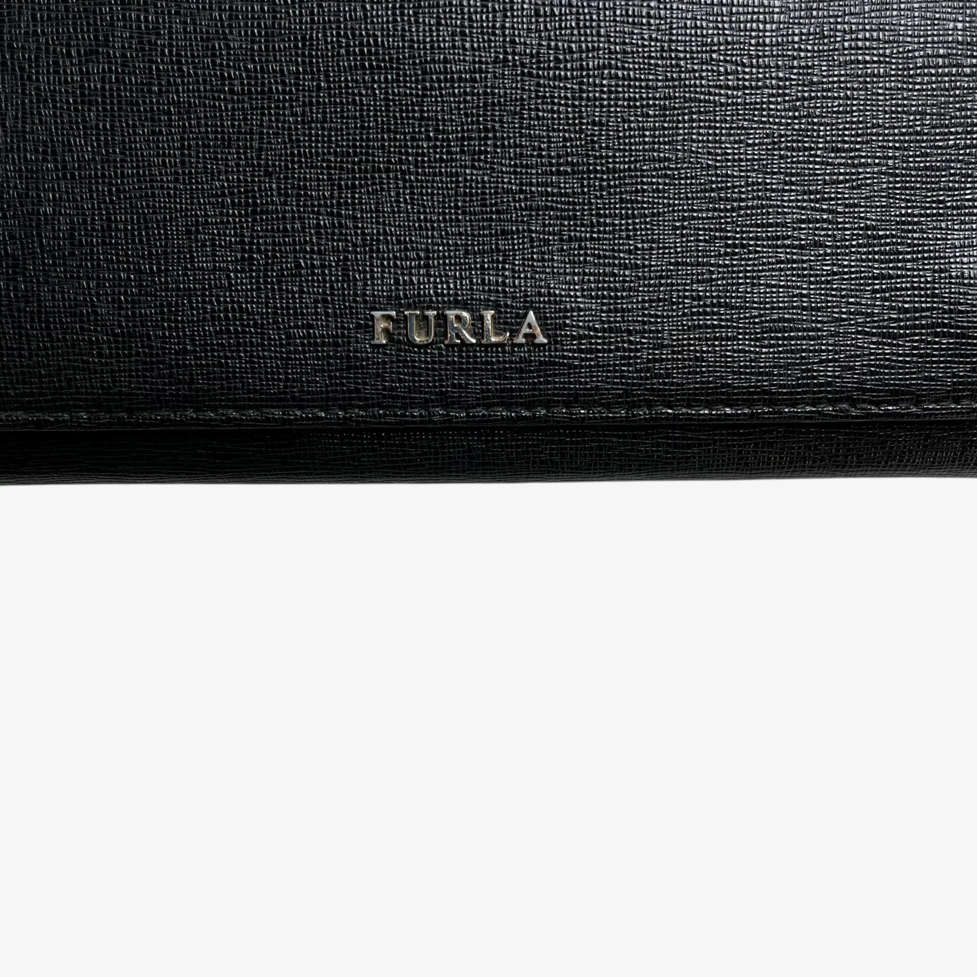 Furla logo on a vintage Y2K black leather continental flap wallet.