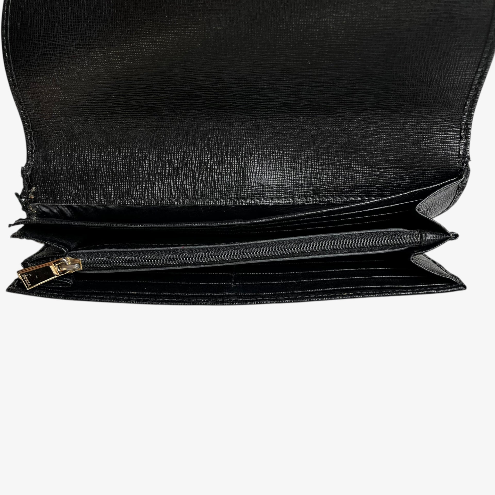 Inside of a vintage Y2K Furla black leather continental flap wallet.