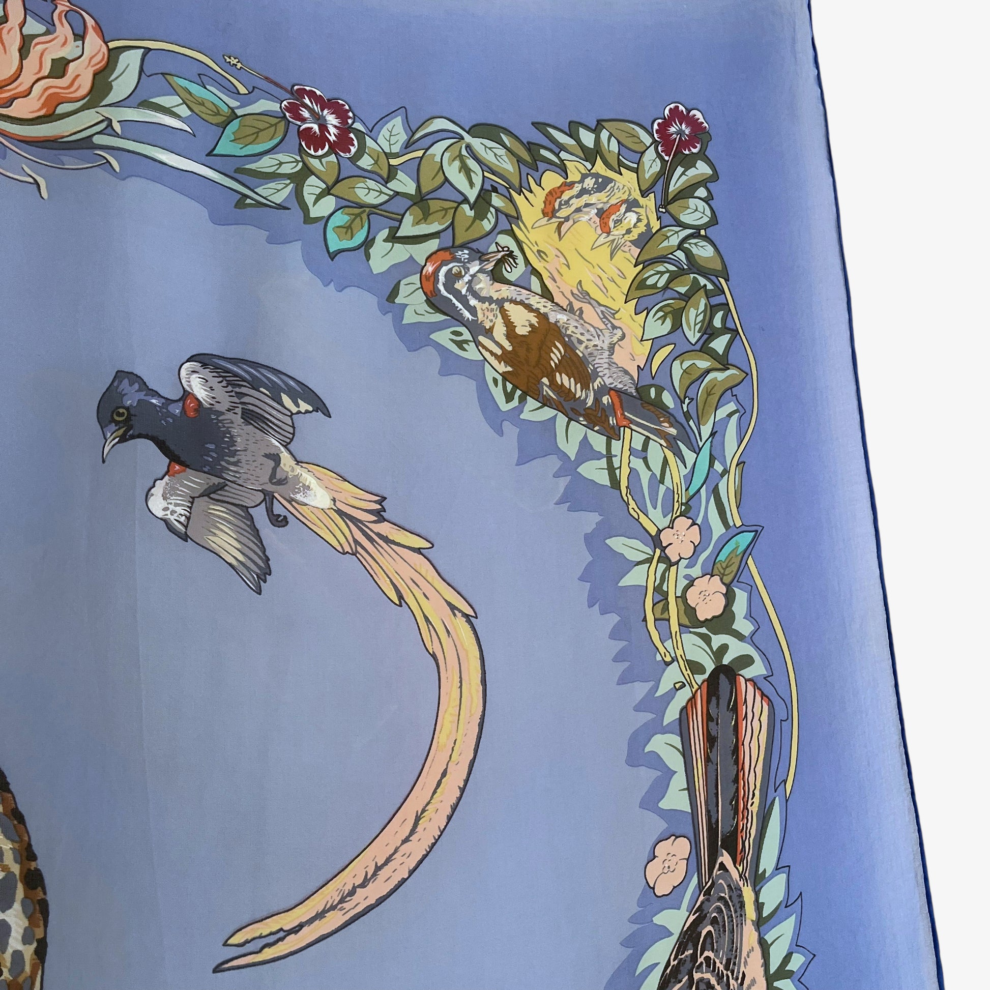 Bird pattern on vintage Y2K Hermes jungle love leopard print blue silk scarf.