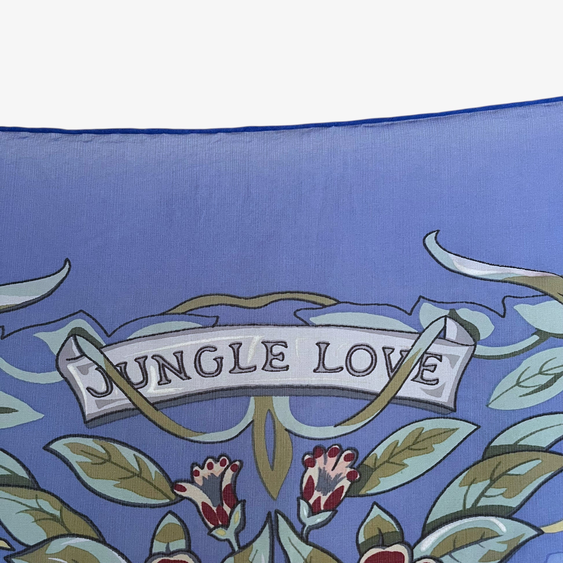Jungle love spell out on vintage Y2K Hermes leopard print blue silk scarf.