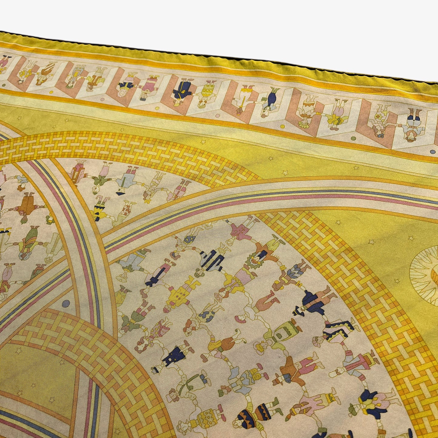 Geometric human pattern on vintage Y2K women's Hermes Paris Donner La Main geometric sun face print yellow silk scarf.