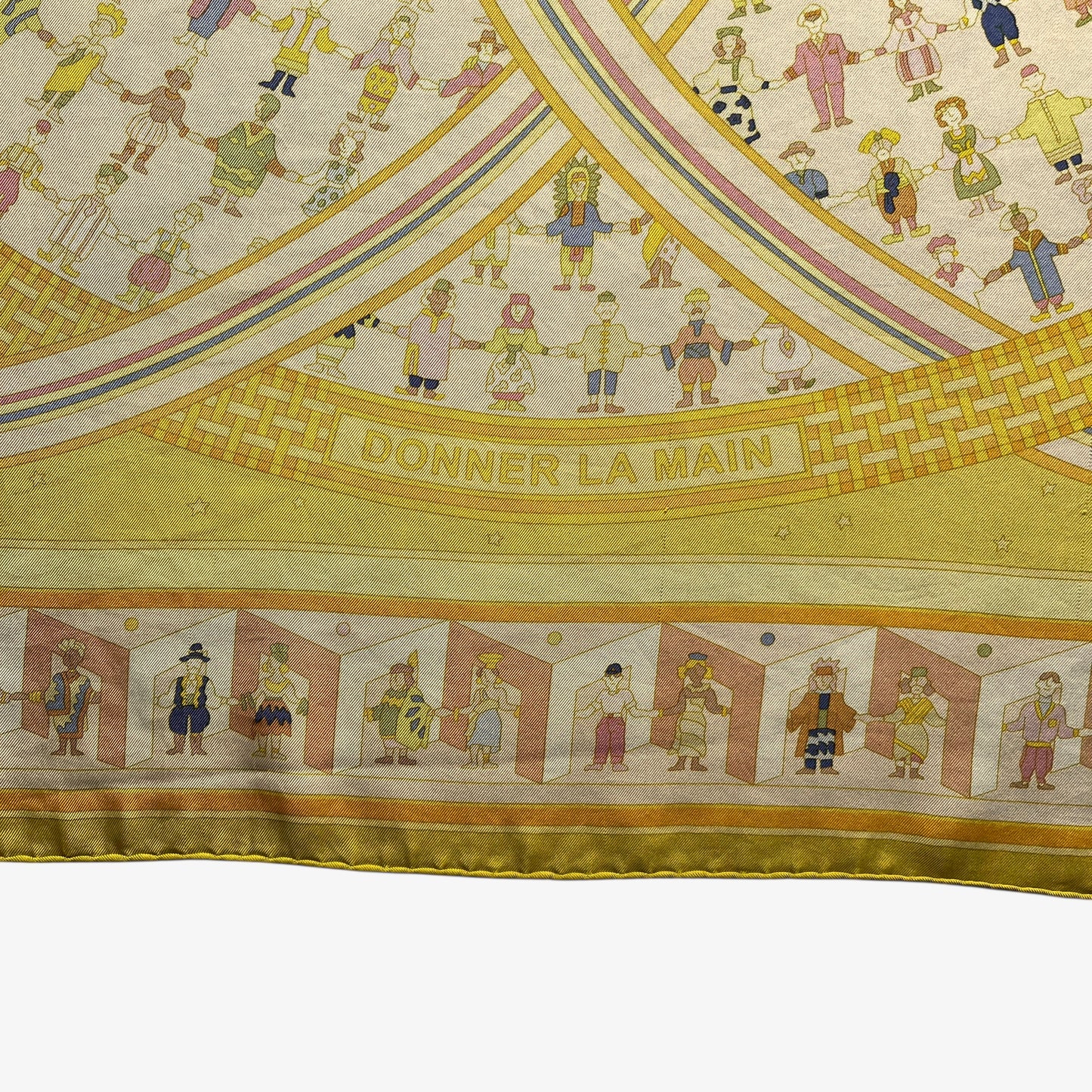 Donner La Main spell out on vintage Y2K women's Hermes Paris geometric sun face print yellow silk scarf.