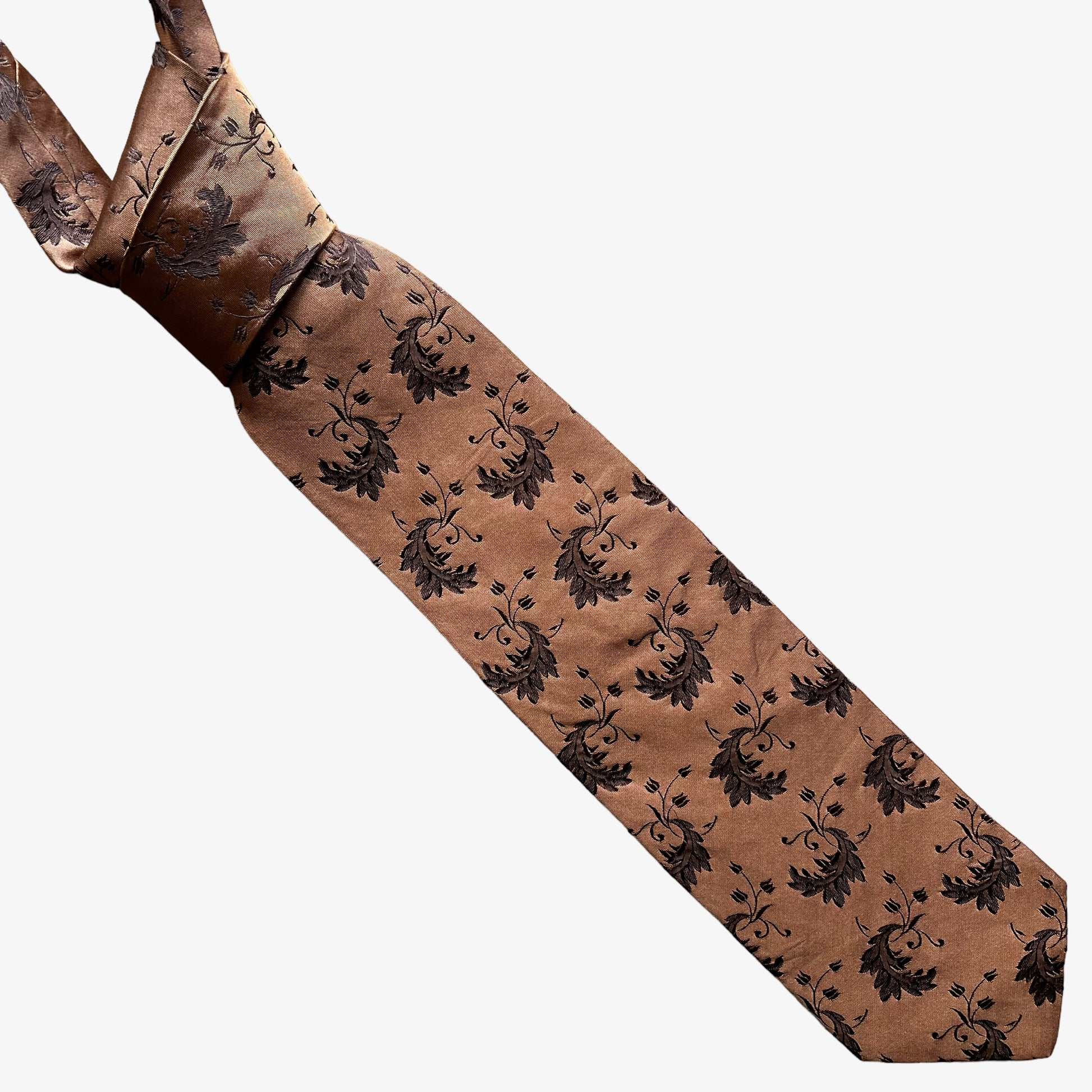 Vintage Y2K Hugo Boss brown silk tie features a geometric floral leaf pattern.