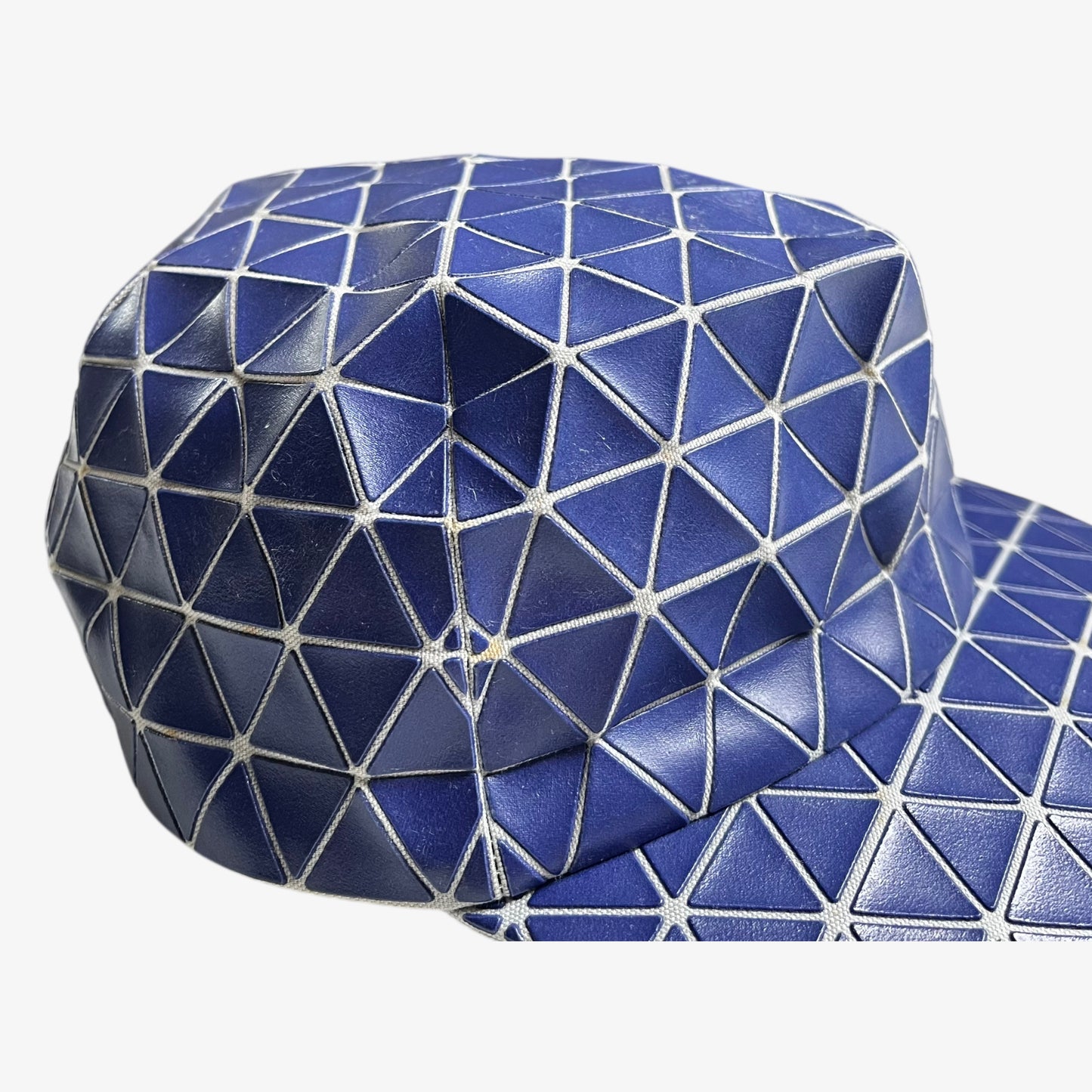 Patina on vintage Y2K Issey Miyake bao bao blue geometric cap.