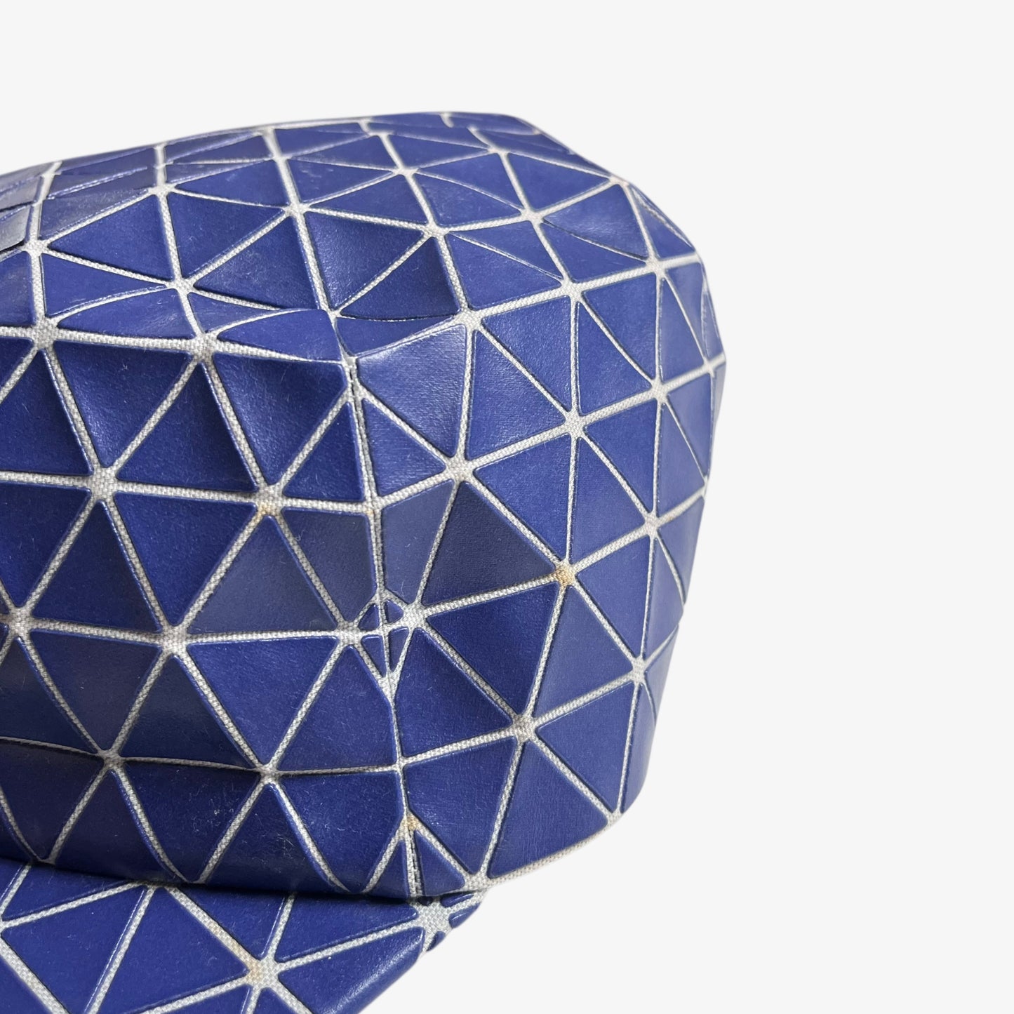Wear on the side of vintage Y2K Issey Miyake bao bao blue geometric cap.