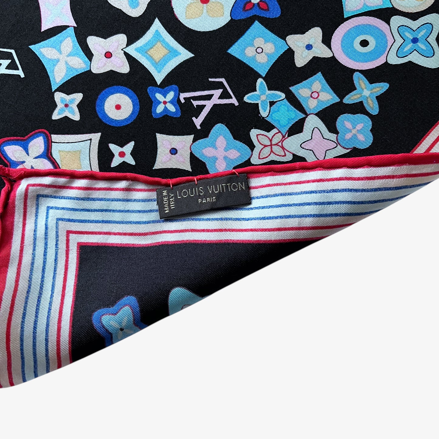 Louis Vuitton made in Italy label of vintage Y2K women's black silk scarf features a colourful LV and abstract floral geometric print.