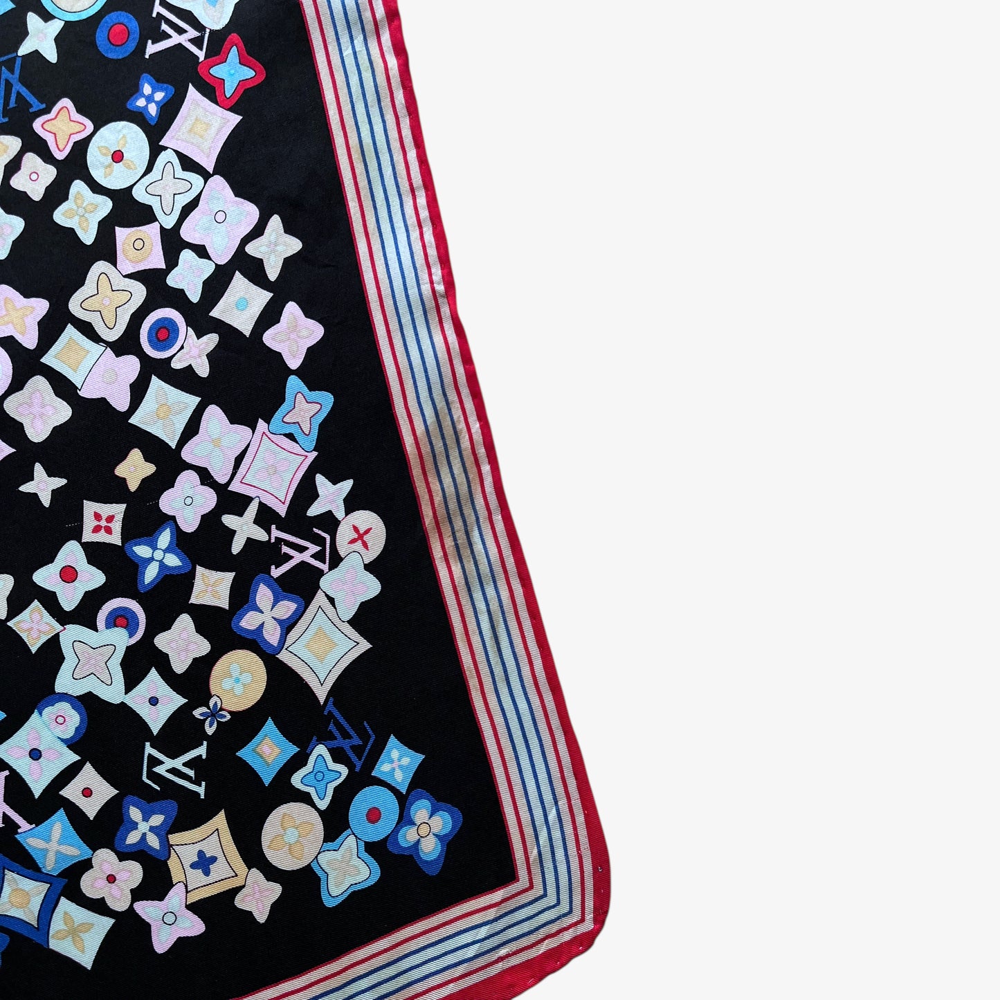 Slight brown marking in the corner of vintage Y2K women's Louis Vuitton black silk scarf features a colourful LV and abstract floral geometric print.
