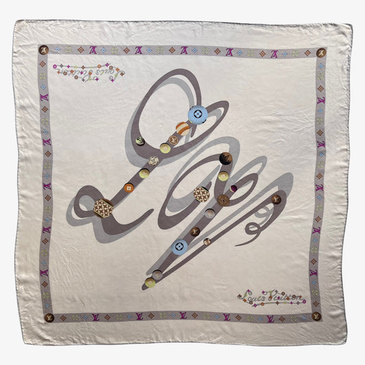 Women's vintage Y2K Louis Vuitton beige silk scarf featuring an LV spell out and solar system print.