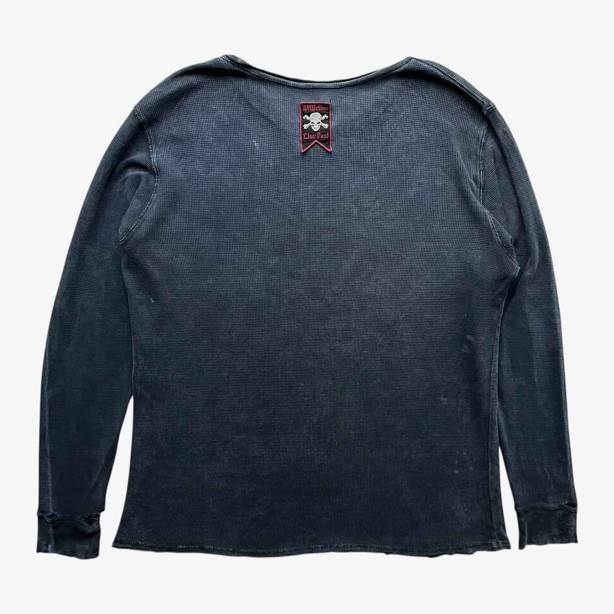 Back of a vintage Y2K men's textured Affliction long sleeve faded navy thrashed t-shirt on a white background.