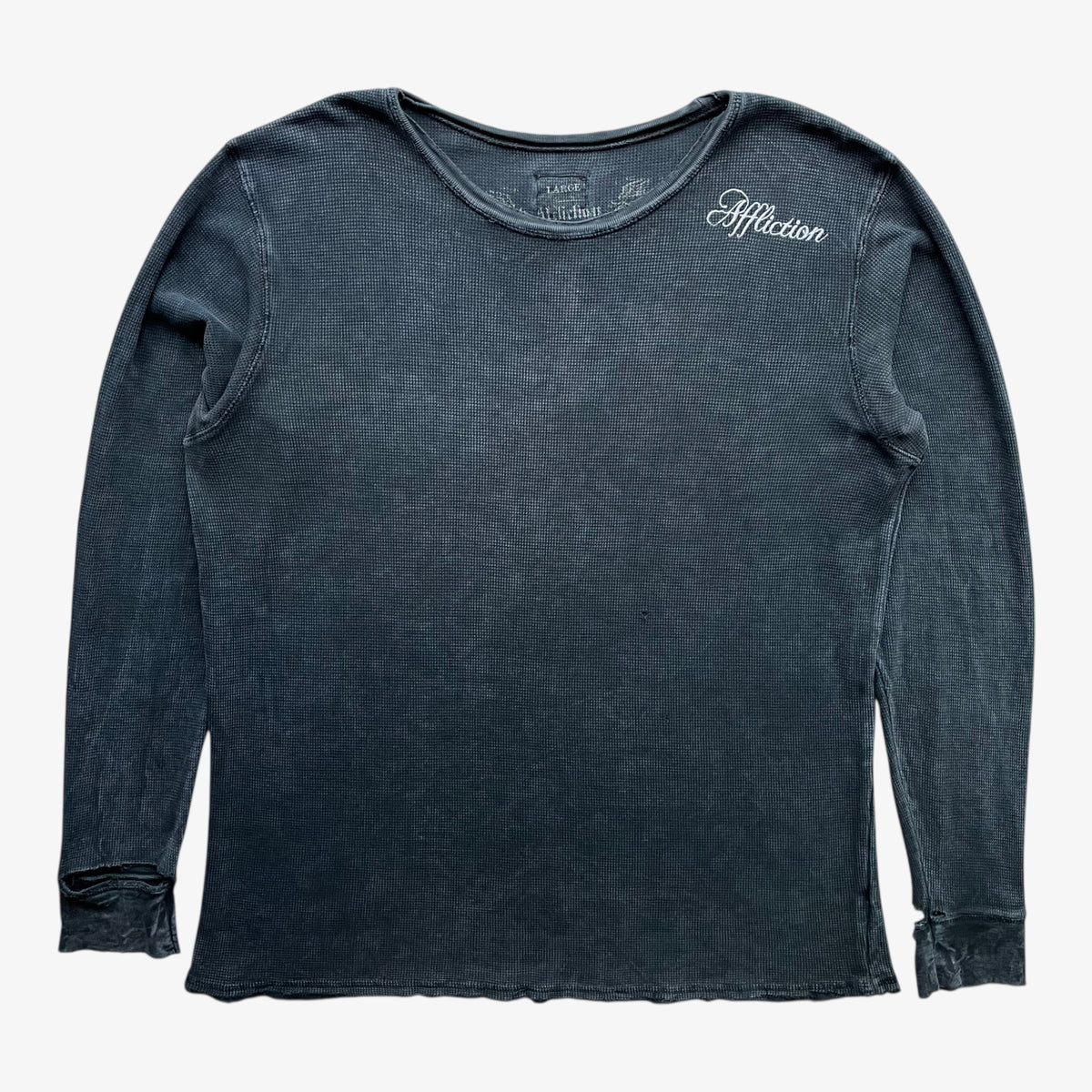 Vintage Y2K men's textured Affliction long sleeve faded navy thrashed t-shirt on a white background.