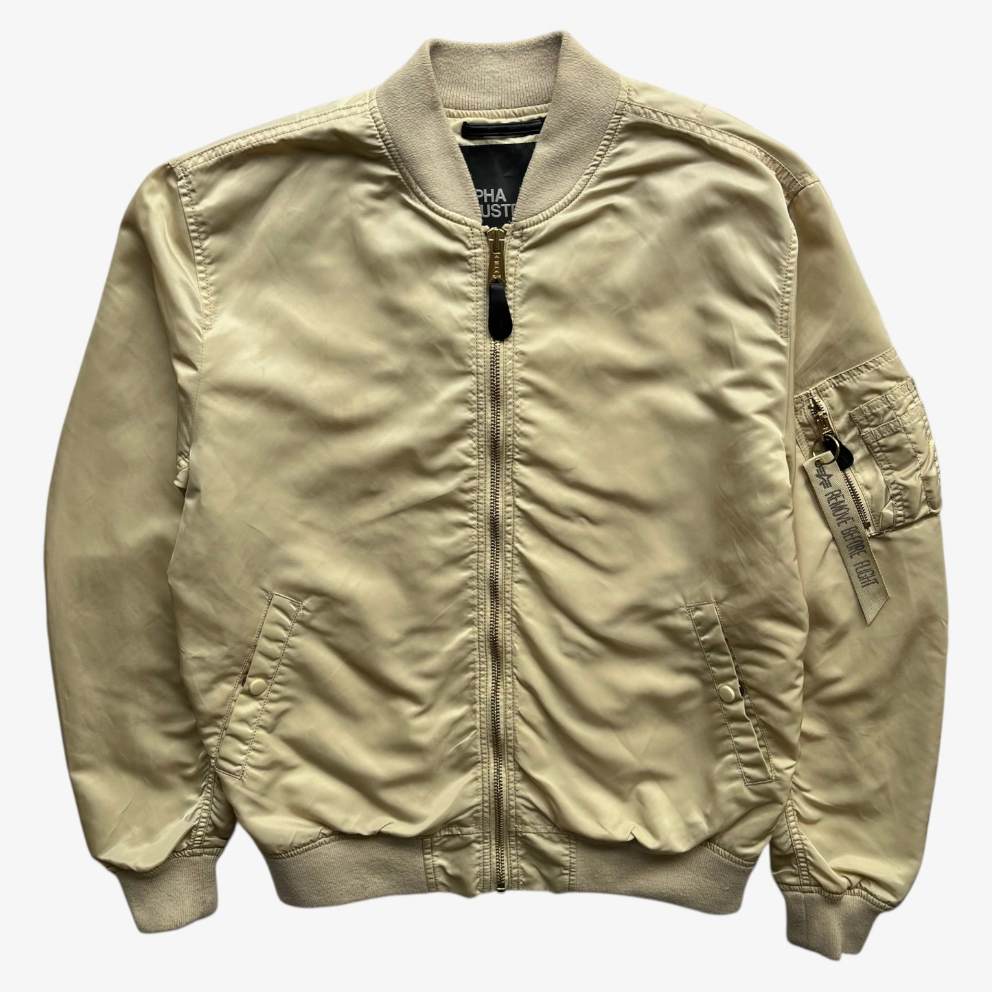 Vintage Y2K men's Alpha Industries beige bomber jacket.