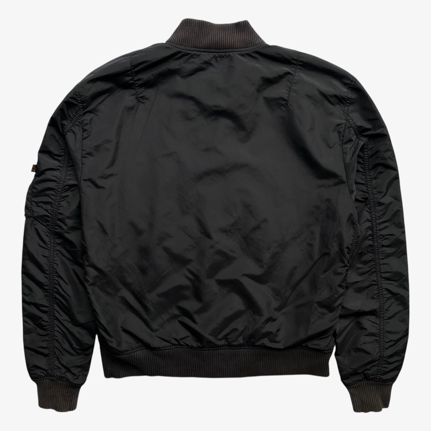 Back of men's vintage Y2K Alpha Industries black bomber jacket.