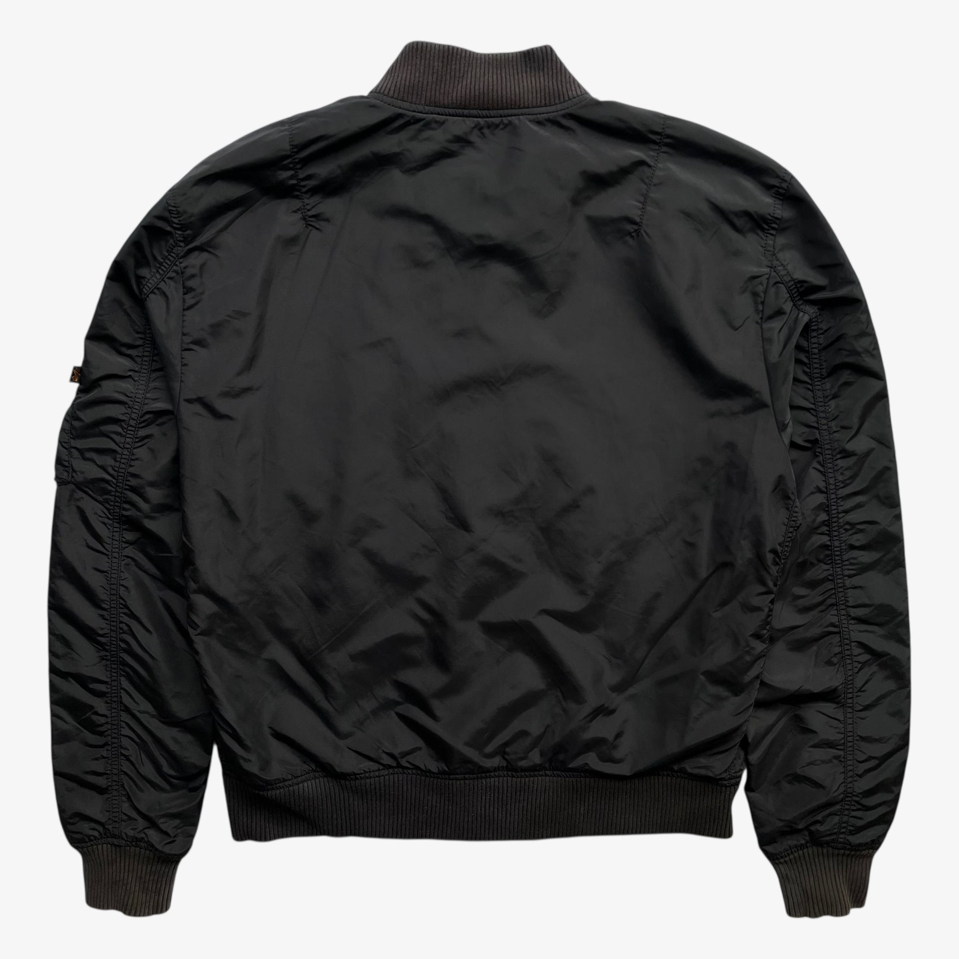 Back of men's vintage Y2K Alpha Industries black bomber jacket.