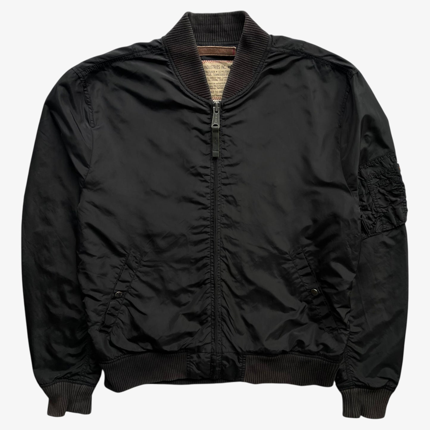 Men's vintage Y2K Alpha Industries black bomber jacket.