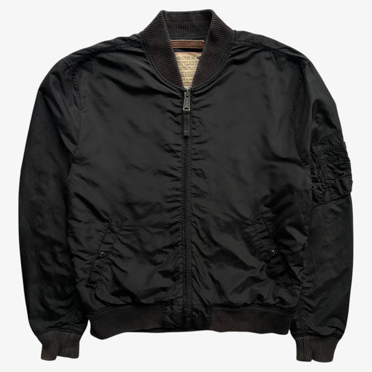 Men's vintage Y2K Alpha Industries black bomber jacket.