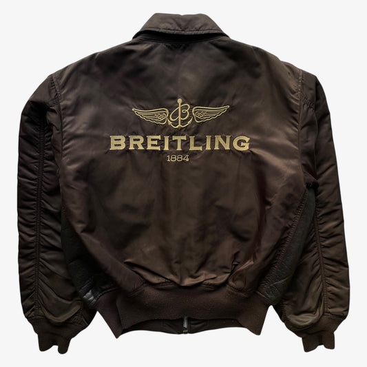 Back of vintage Y2K men's Alpha Industries Breitling brown leather CWU-45 bomber jacket.