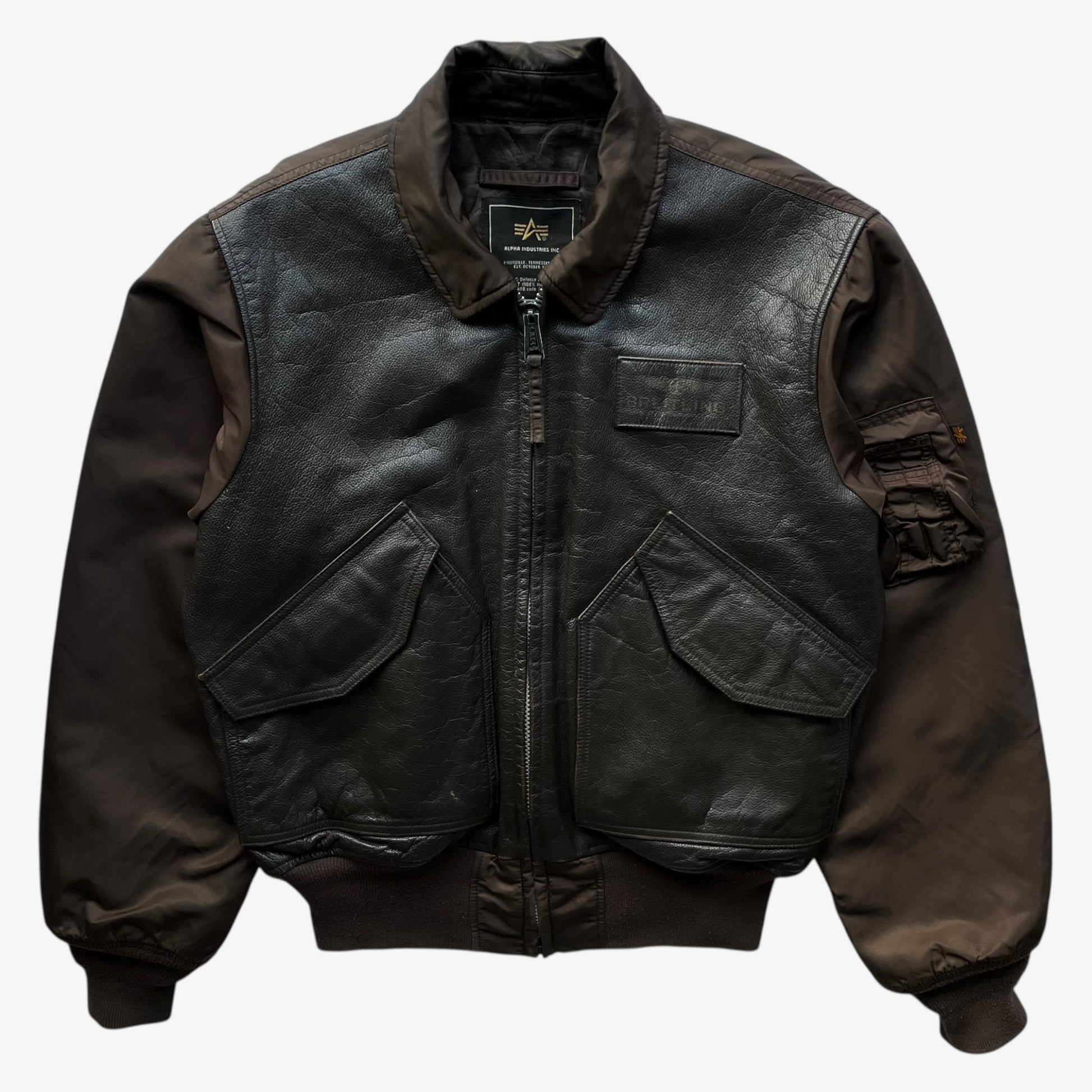 Vintage Y2K men's Alpha Industries Breitling brown leather CWU-45 bomber jacket.