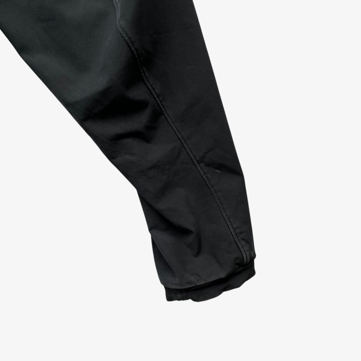 Sleeve of men's vintage Y2K Arcteryx Polartec black hooded utility jacket.
