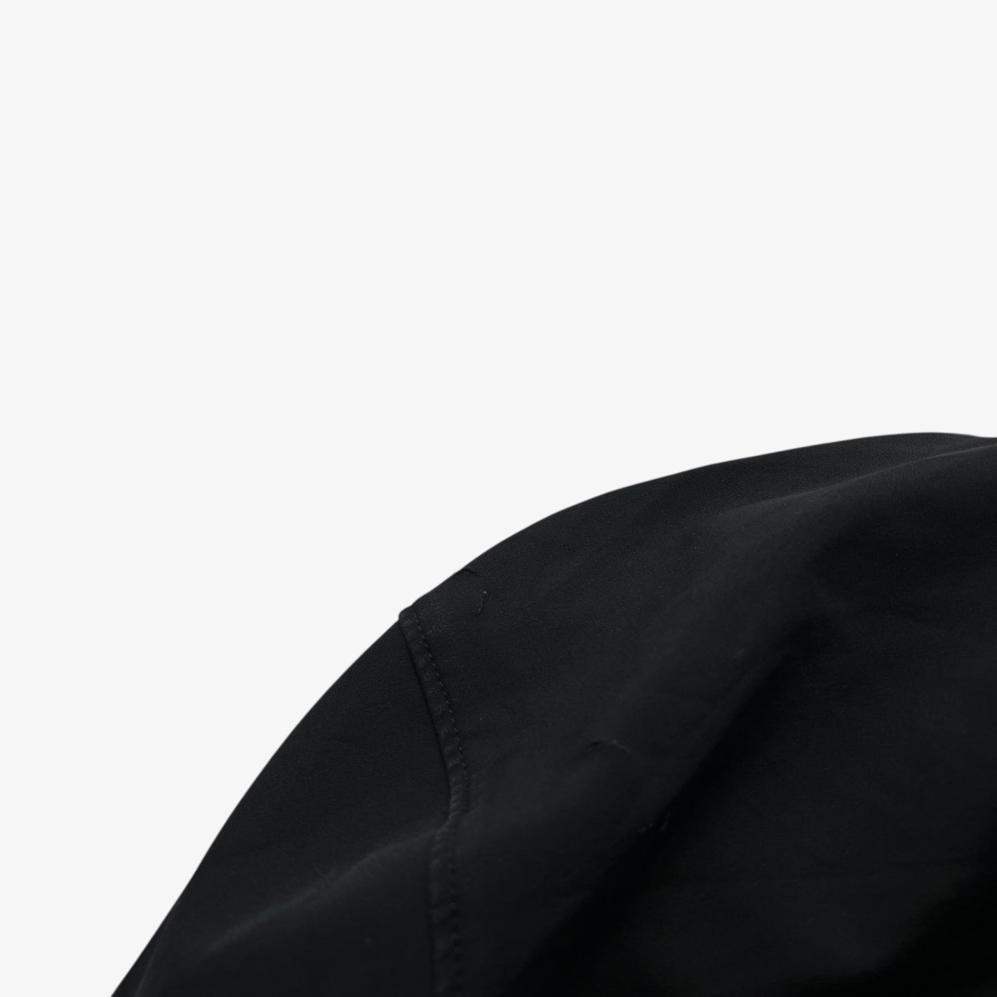 Patina on hood of men's vintage Y2K Arcteryx Polartec black utility jacket.