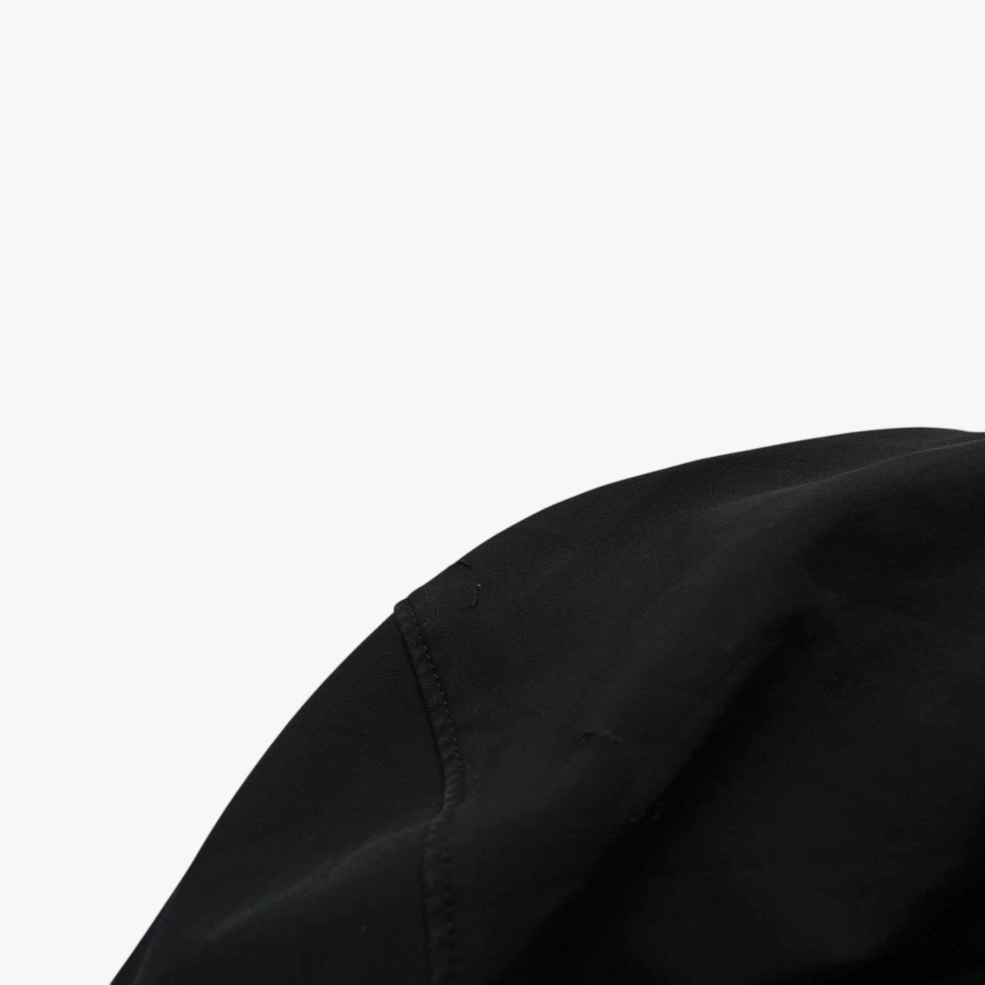 Patina on hood of men's vintage Y2K Arcteryx Polartec black utility jacket.