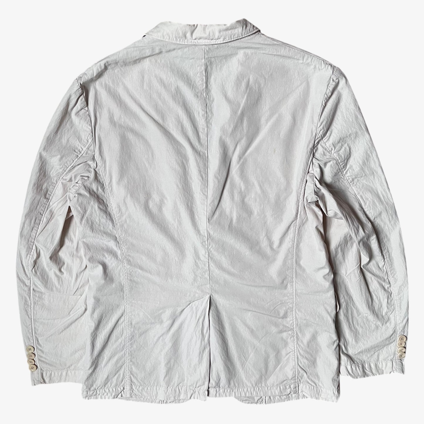 Back of vintage Y2K men's CP Company cream single breasted blazer.