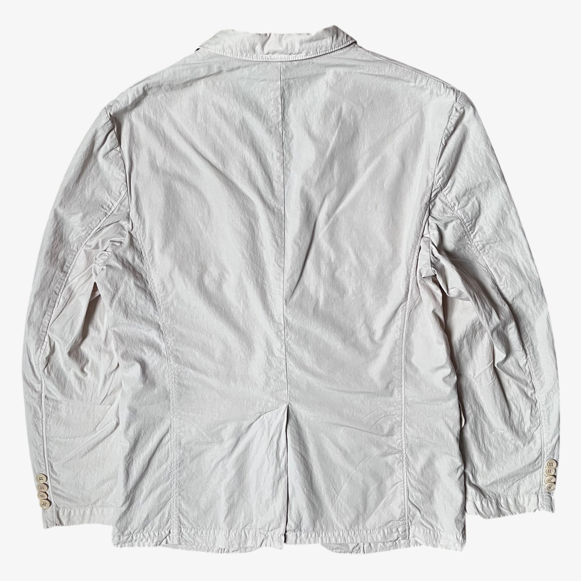 Back of vintage Y2K men's CP Company cream single breasted blazer.