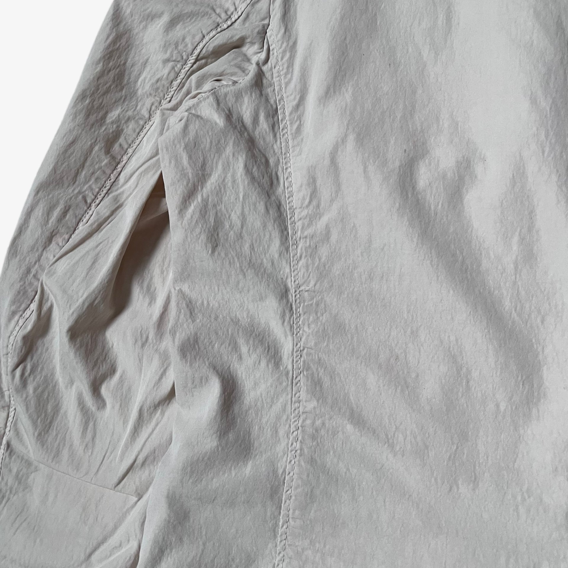 Close up of back on vintage Y2K men's CP Company cream single breasted blazer.