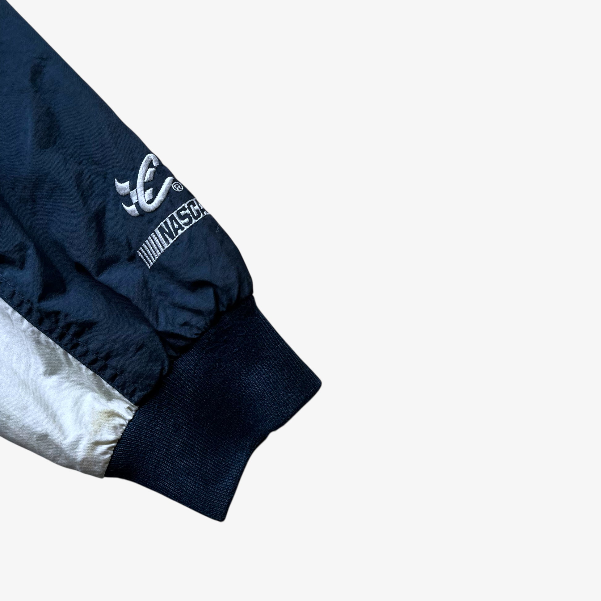 Embroidered cuff of men's vintage Y2K Chase Authentics 2005 team nascar blue jacket.