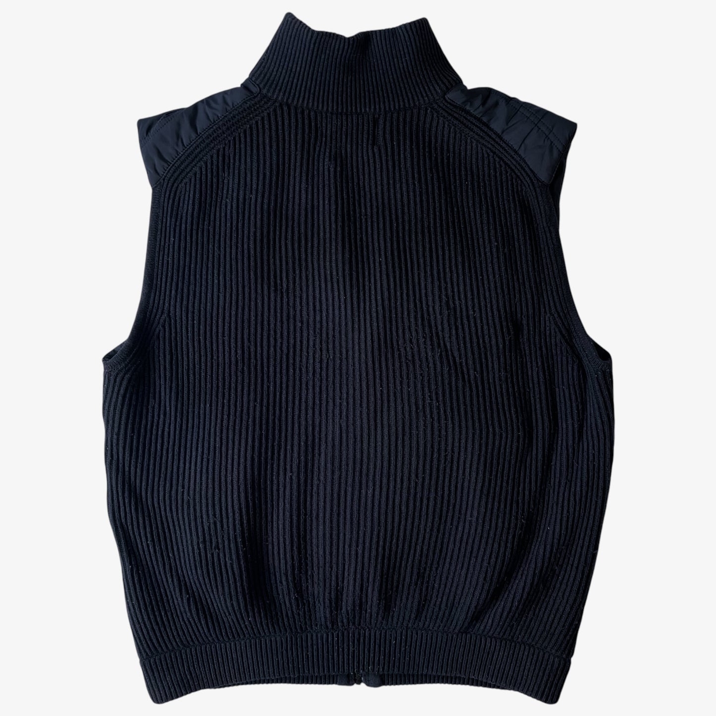 Back of vintage black wool ribbed puffer gilet.