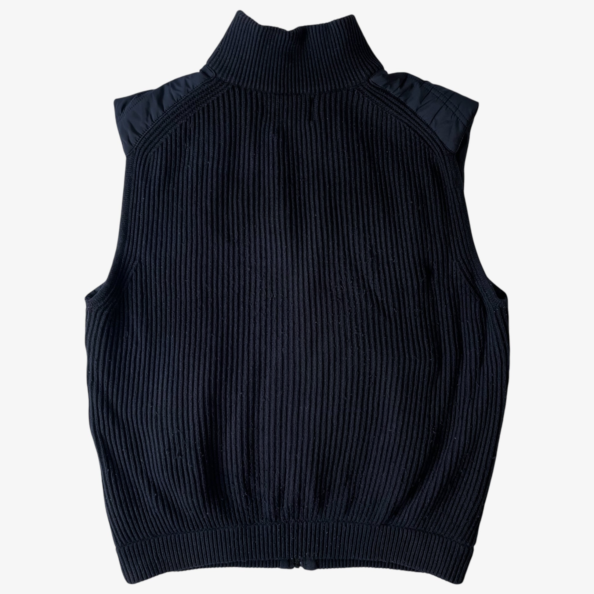 Back of vintage black wool ribbed puffer gilet.