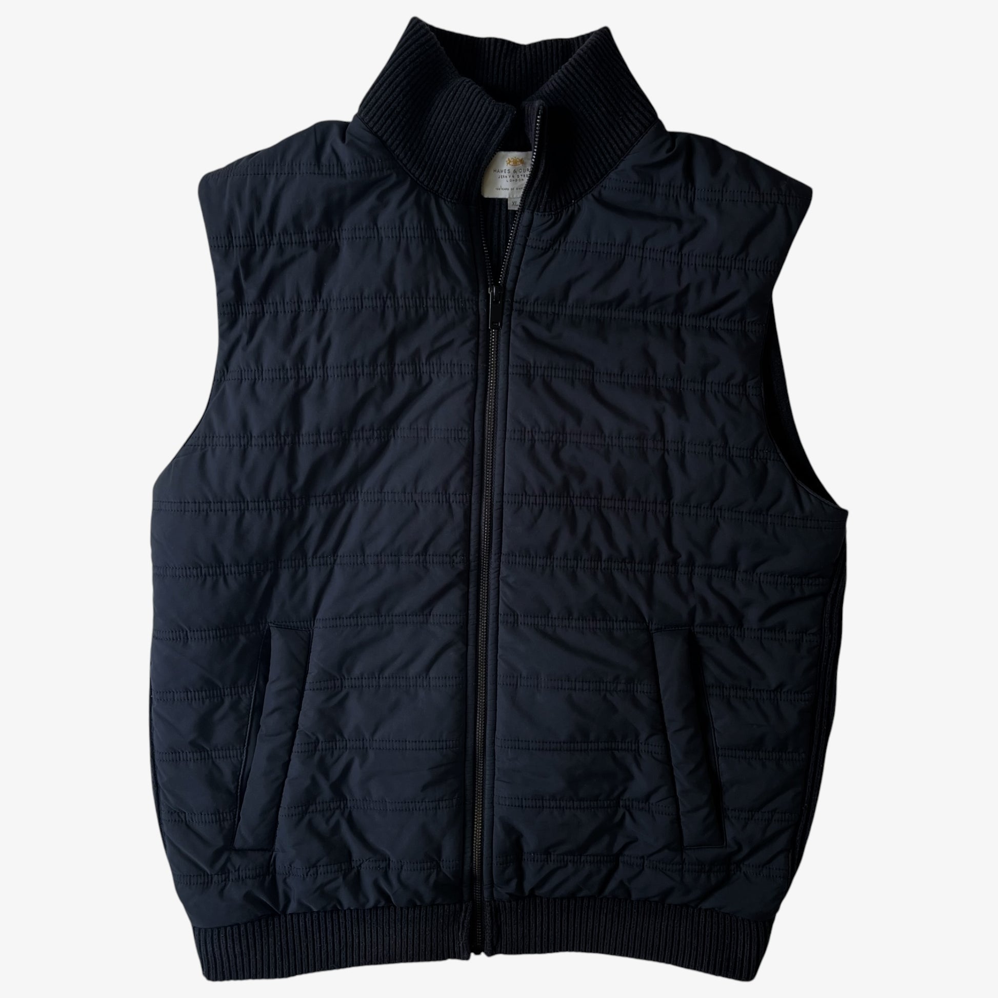 Vintage black quilted puffer gilet with two side pockets.
