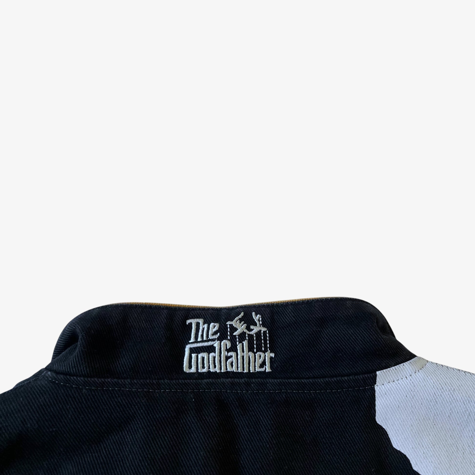 The Godfather embroidered collar spell out on a vintage Jeff Hamilton jacket.