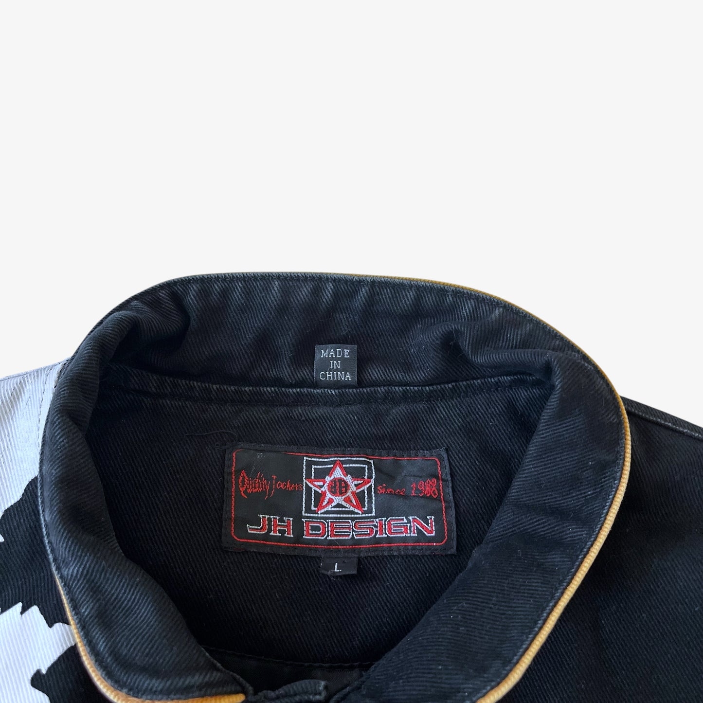 Jeff Hamilton JH Design label stitched inside black nascar jacket.