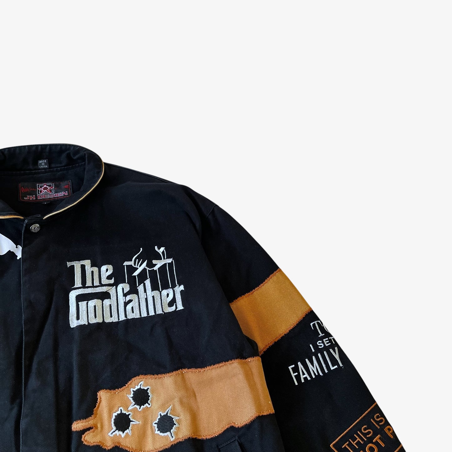 Embroidered bullet holes on a vintage Godfather Jeff Hamilton jacket.