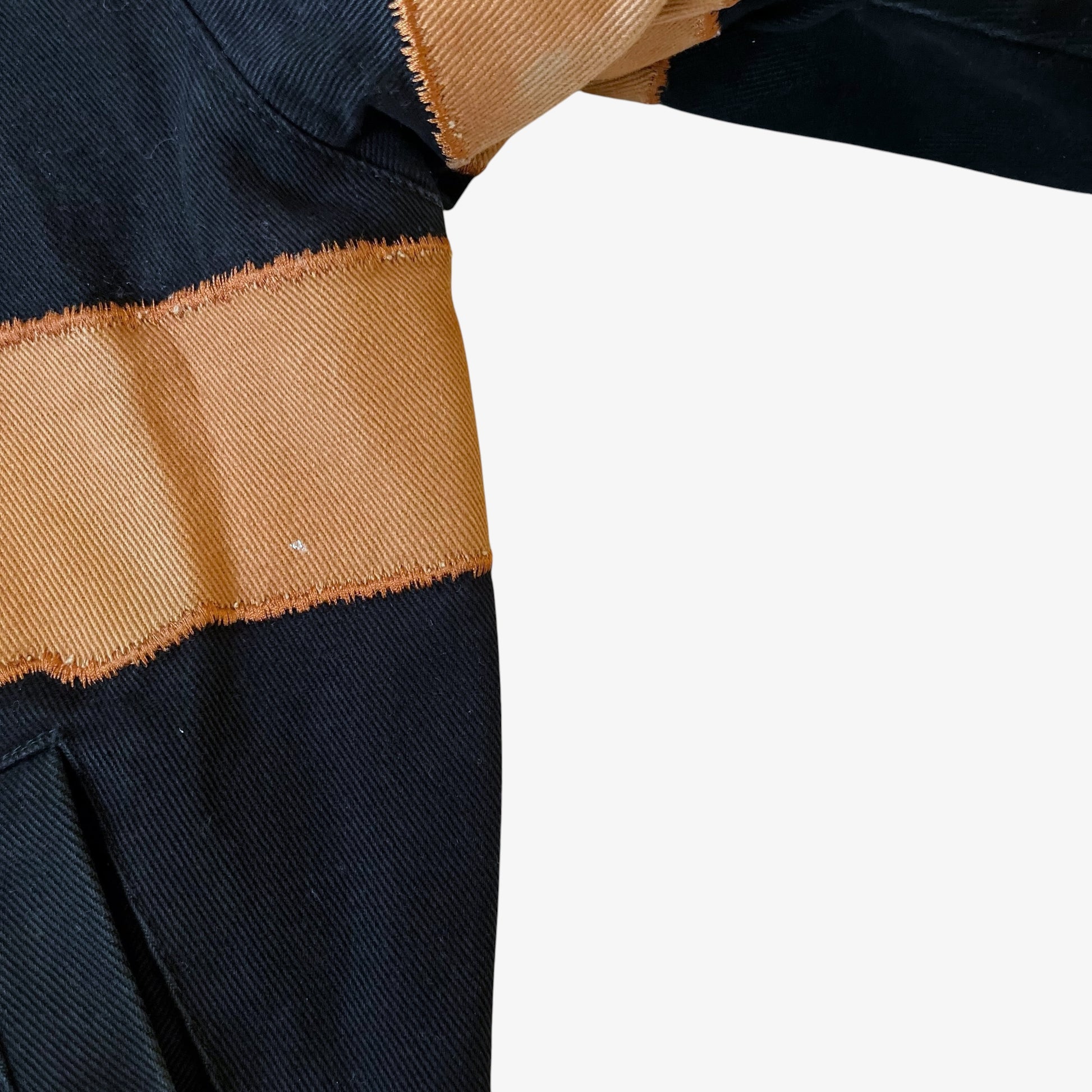 Close up of wear on a vintage Jeff Hamilton the Godfather jacket.