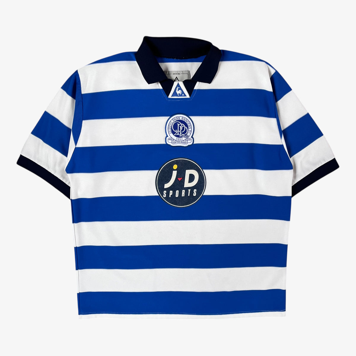 Blue and white vintage QPR 2001 striped football jersey with JD sports sponsor on a white background