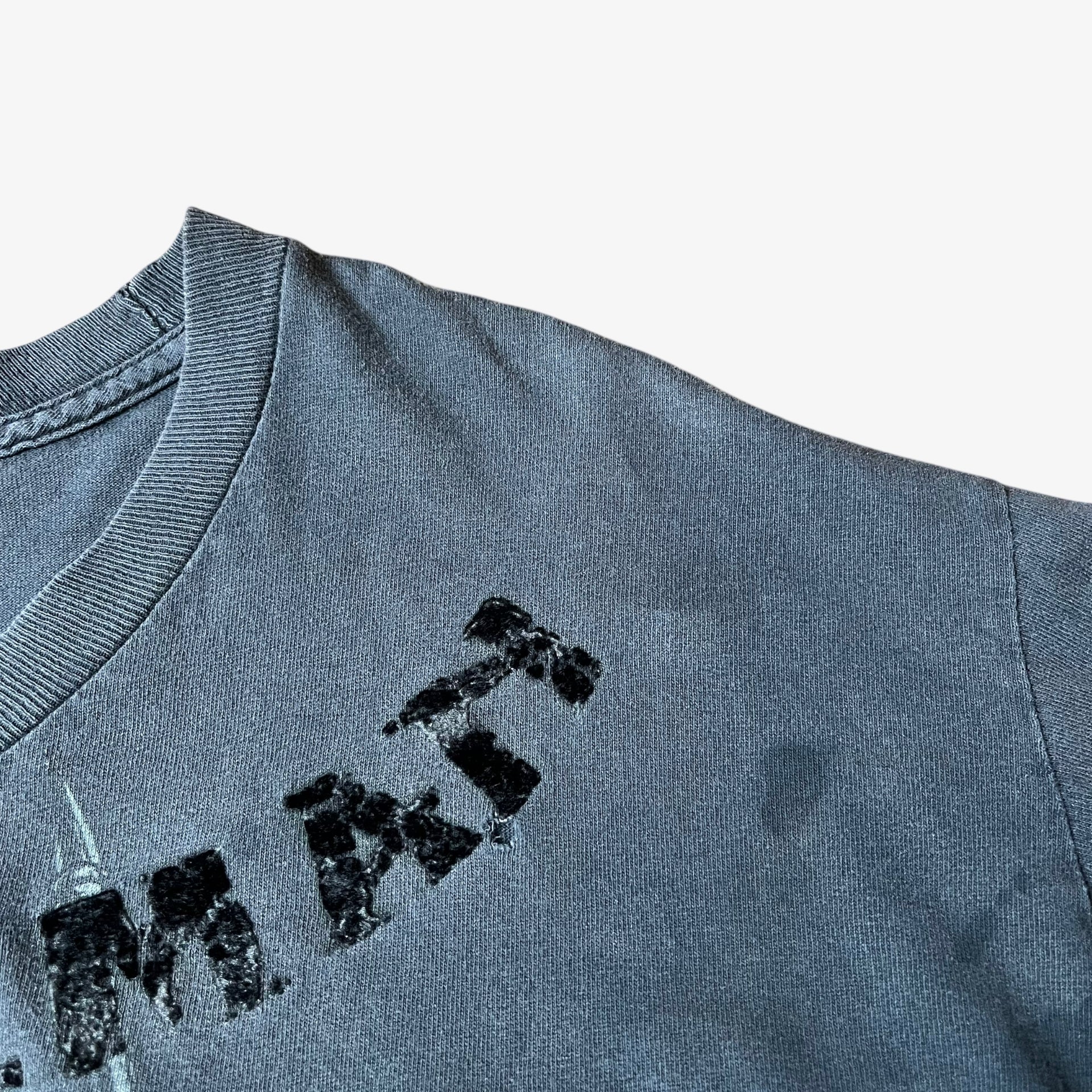 Wear on vintage Y2K men's MMA Elite Chuck Liddell Iceman Samurai print t-shirt.